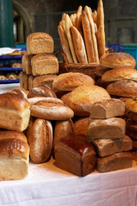 Various loaves piled on market stall